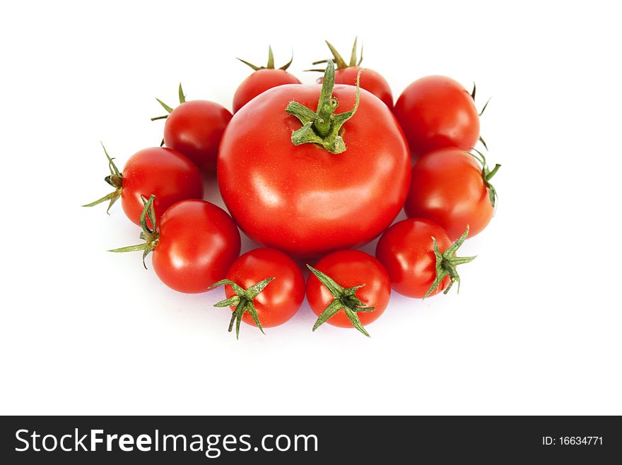 Tomatoes and cherry tomatoes on a withe background