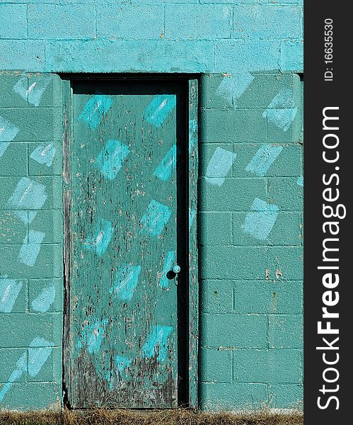 Closeup of a textured turquoise door