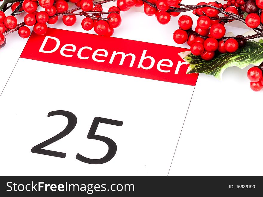 Calendar Date of 25 December with seasonal holly and red berries. Calendar Date of 25 December with seasonal holly and red berries