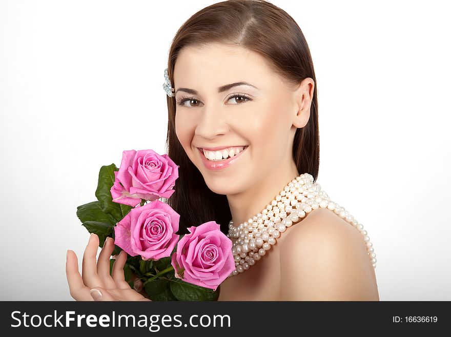 Young beautiful woman with flowers roses. Young beautiful woman with flowers roses