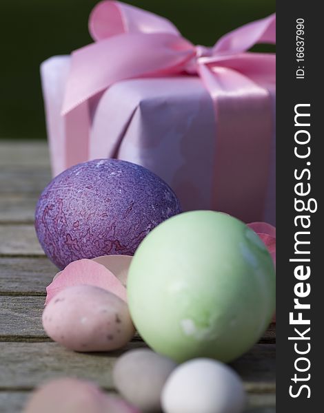 Easter eggs in pastel color with a gift modern deco