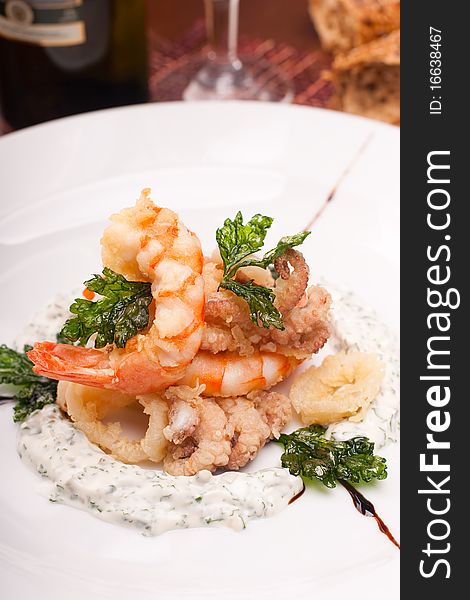 Delicatessen dish with seafoods, shrimps and  octopuses