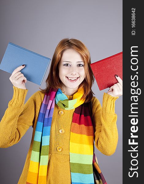 Student girl with two books. Studio shot.