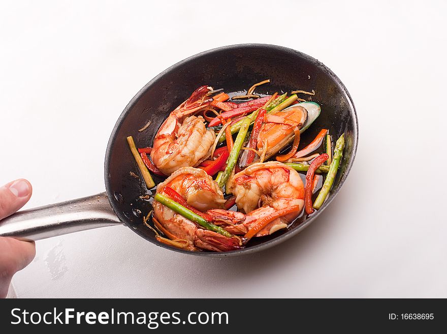 Seafoods and vegetables on pan