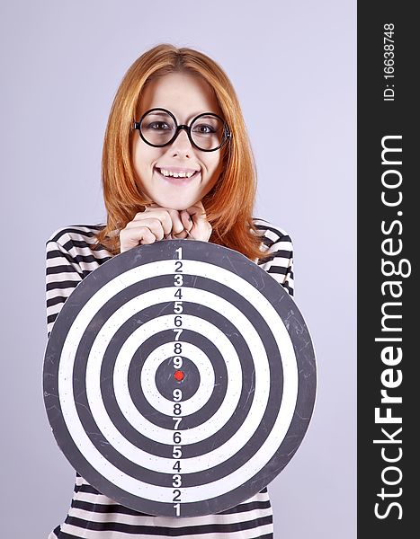 Red-haired girl with dartboard.