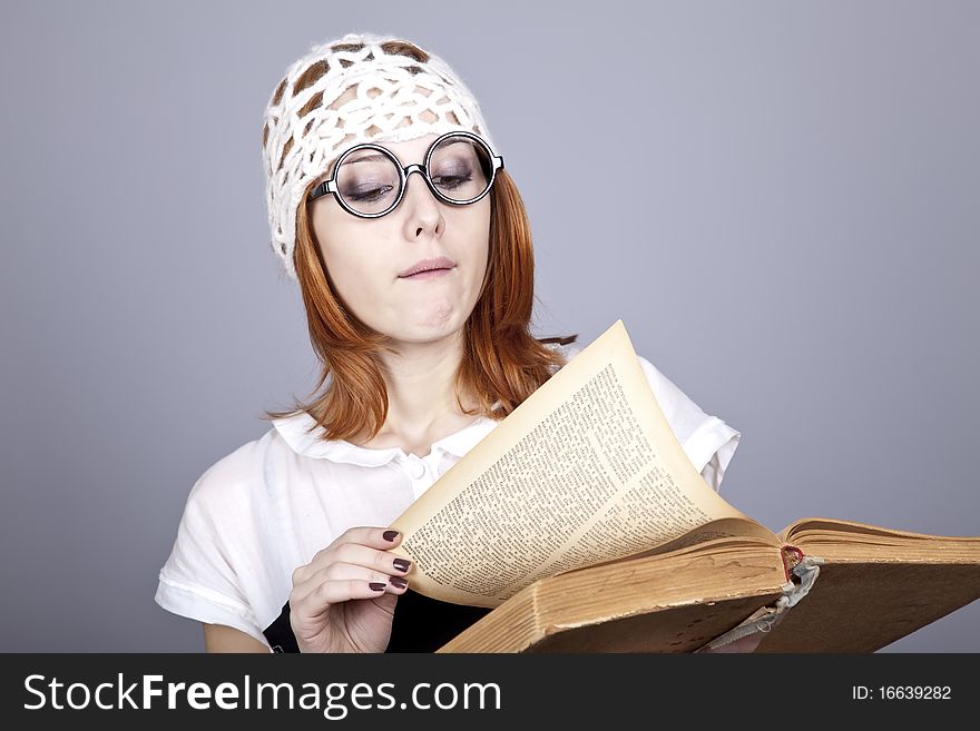 Funny Red-haired Girl With Old Book.
