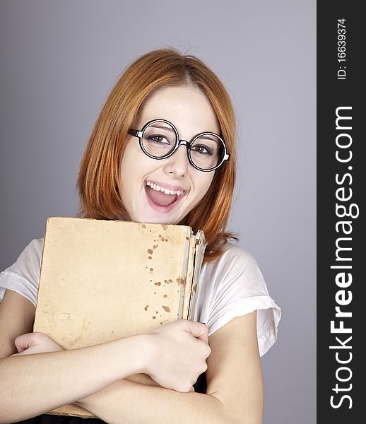 Funny Red-haired Girl With Old Book.