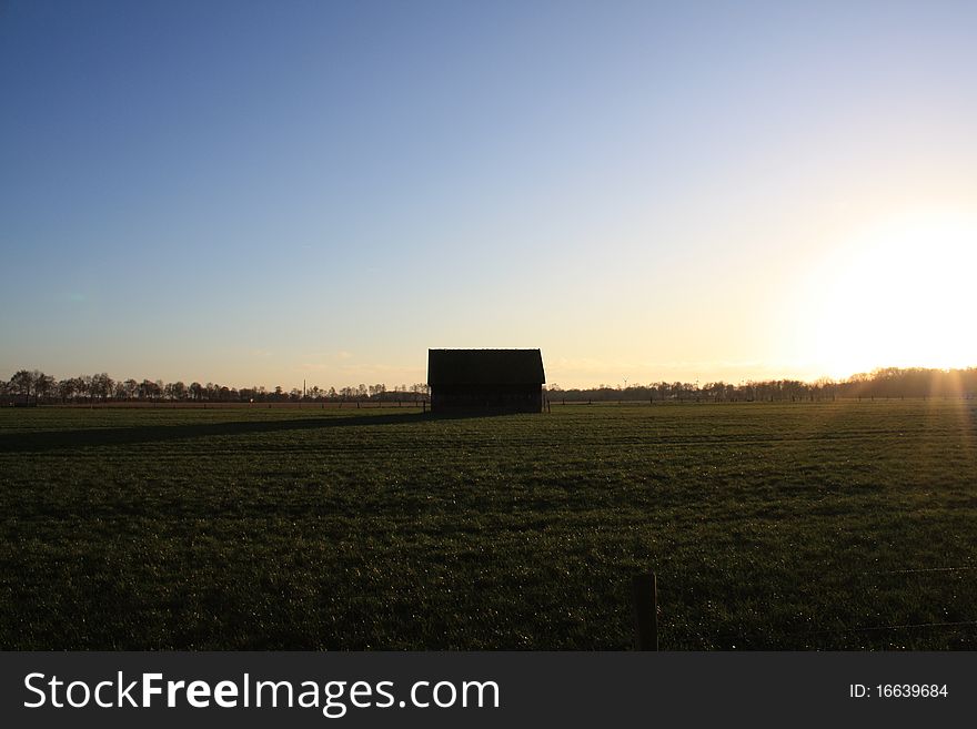 Farming Shed with shadow at sundown