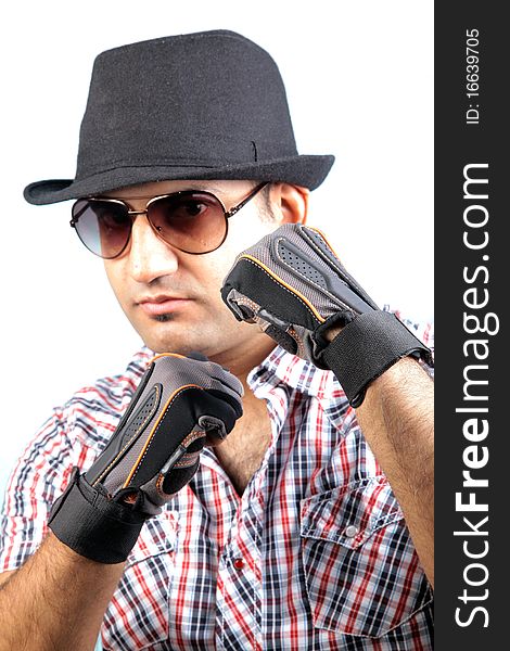 A young male fashion model wearing a black hat and goggles. A young male fashion model wearing a black hat and goggles.