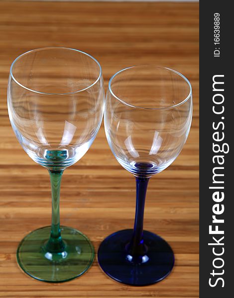 Wine glasses on wooden background.