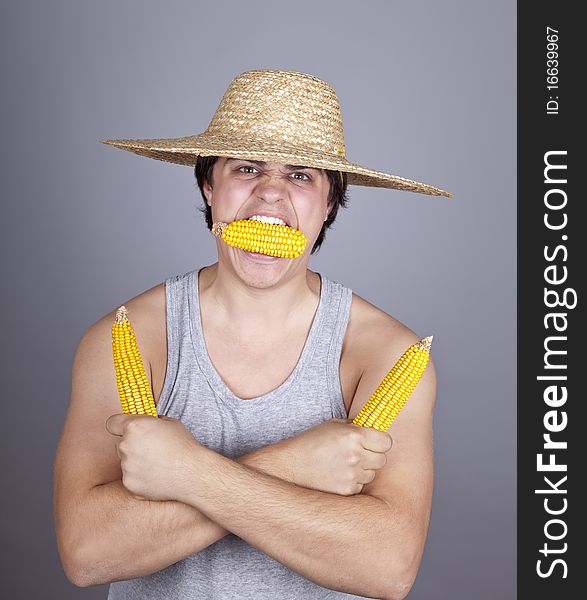 Aggressive farmer show three corns. Studio shot.