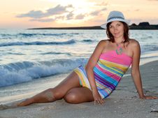 Woman In A Colorful Dress And Hat On The Beach Royalty Free Stock Photography
