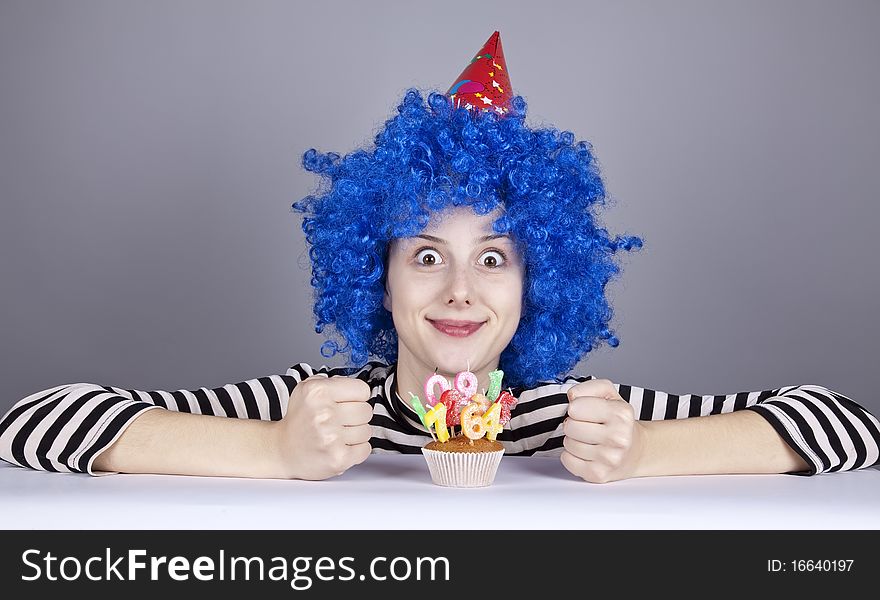 Funny blue-hair girl with cake.