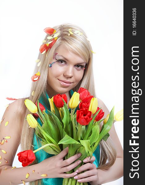 Happy young woman holding a bunch with tulips. Happy young woman holding a bunch with tulips