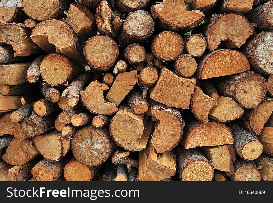 Logs of firewood in a nice stack, all piled up together. Logs of firewood in a nice stack, all piled up together.