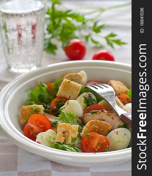 A grilled chicken salad with crunchy croutons. Healthy and delicious!