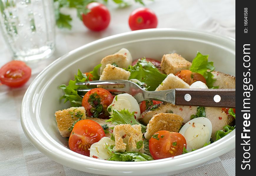 A grilled chicken salad with crunchy croutons. Healthy and delicious!