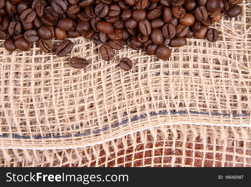 Burlap material and coffee beans in close up