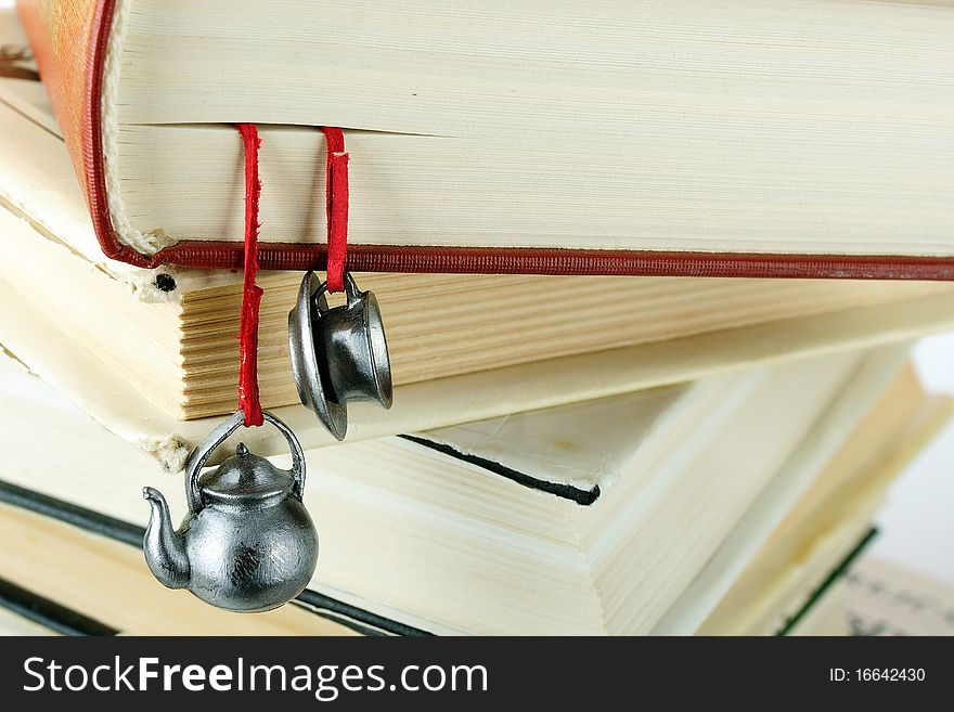 Stack Of Used Books With A Hand-made Bookmark