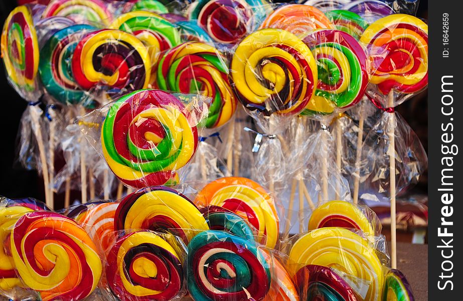 Many colourful lollipops, with yellow, red and green. Many colourful lollipops, with yellow, red and green