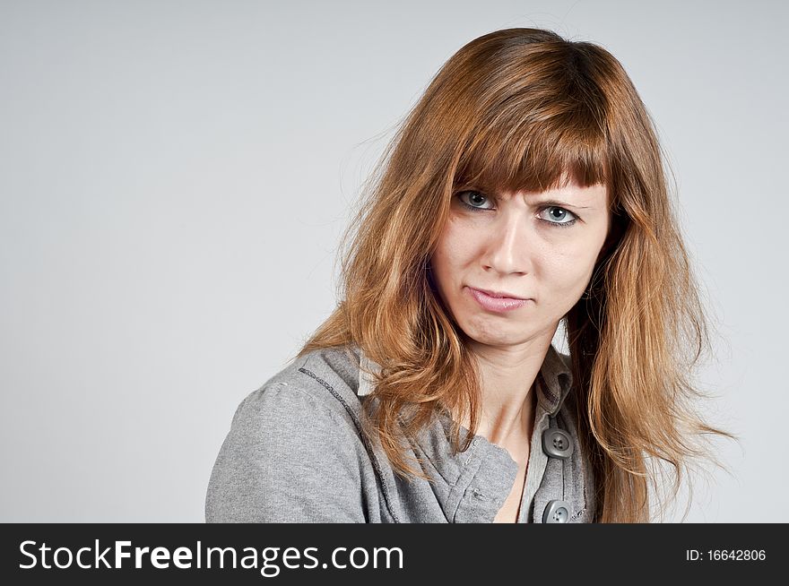 Portrait Of Blonde Girl Doubtful