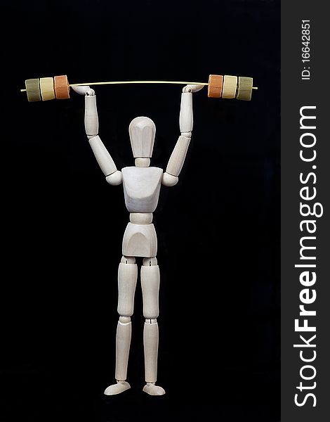 Wooden model figure exercising with a weight barr. Wooden model figure exercising with a weight barr