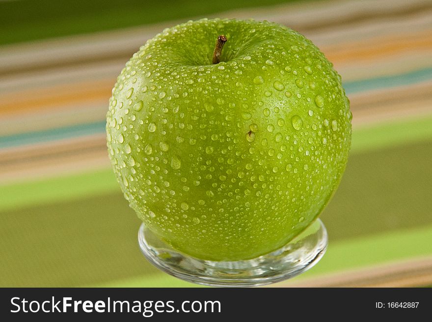 Green Apple Covered With Water Droplets