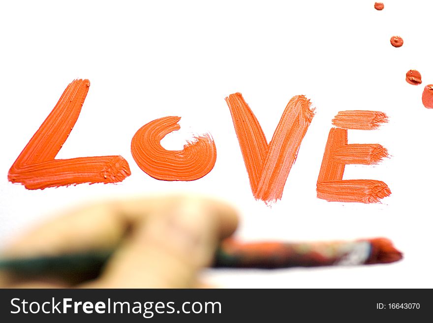 Painting the word love with the paintbrush