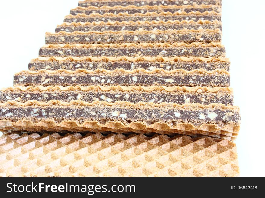 Wafer cookies with chocolate are isolated on a white background