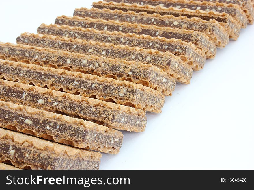 Wafer cookies with chocolate are isolated on a white background