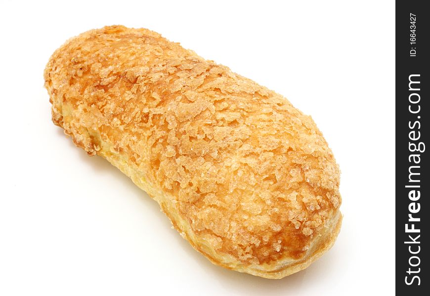 White roll strewed by sugar with a ruddy crust on a white background