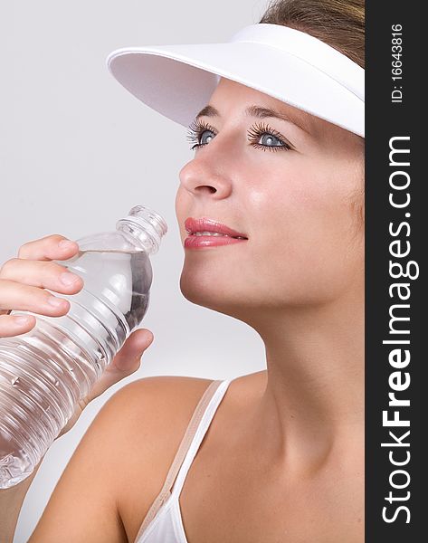 Young smiling woman with a bottle of water. Young smiling woman with a bottle of water