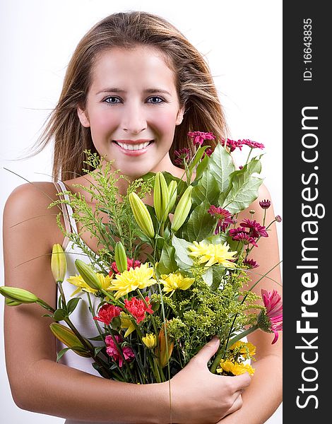 Young woman with a bunch of fresh field flowers. Young woman with a bunch of fresh field flowers