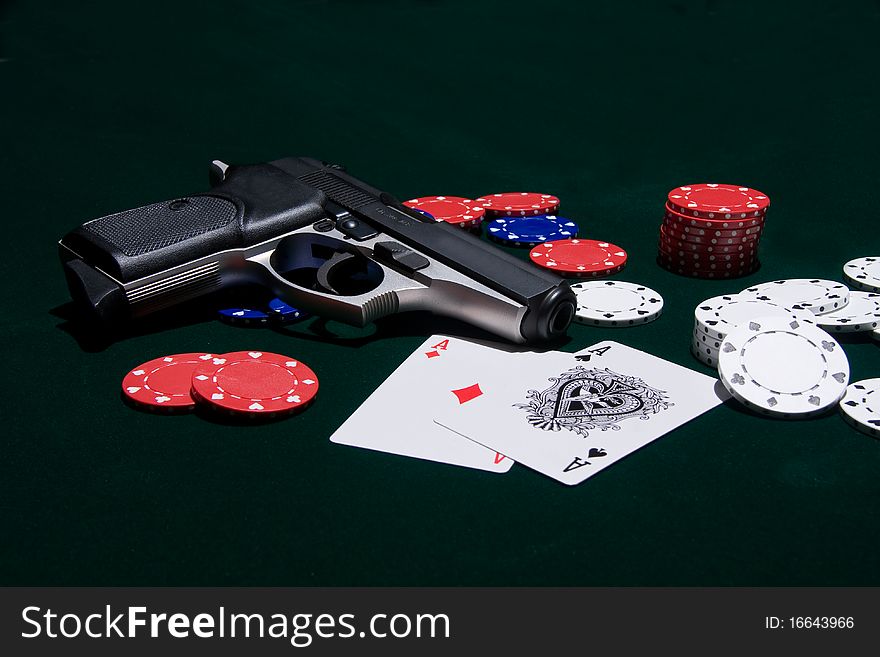 Iconic combination of cards, chips and a handgun. Iconic combination of cards, chips and a handgun.
