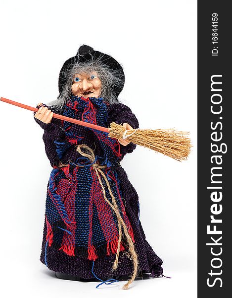 Old Halloween witch with broomstick and hat isolated on white background