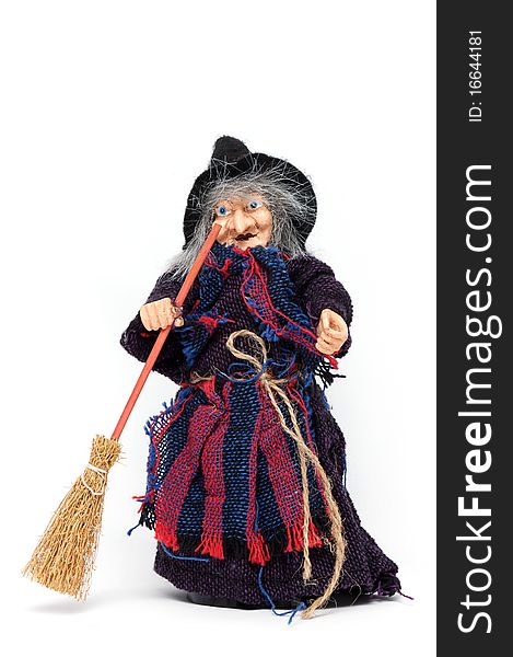 Old Halloween witch with broomstick and hat isolated on white background