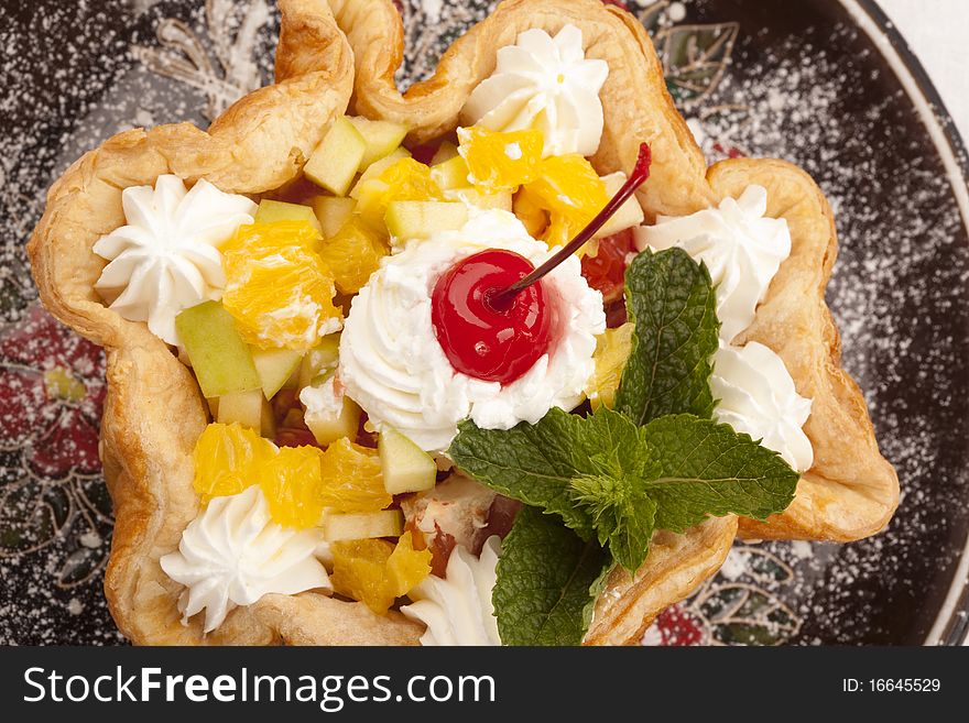 Baked basket cake and maraschino cherry