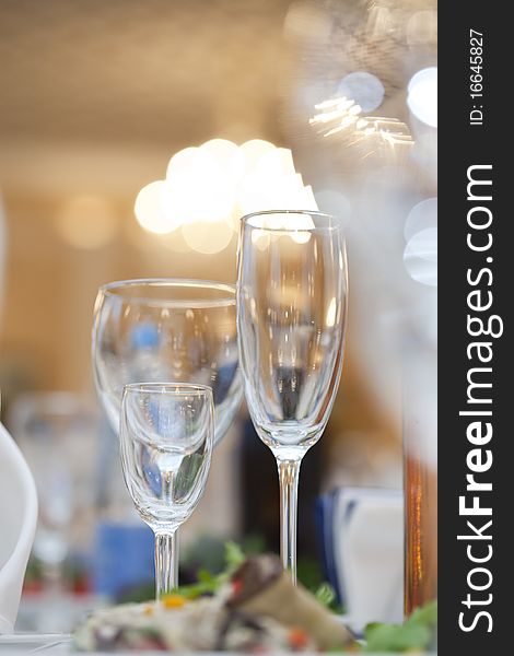 Three wine glasses on a white festive table. Three wine glasses on a white festive table