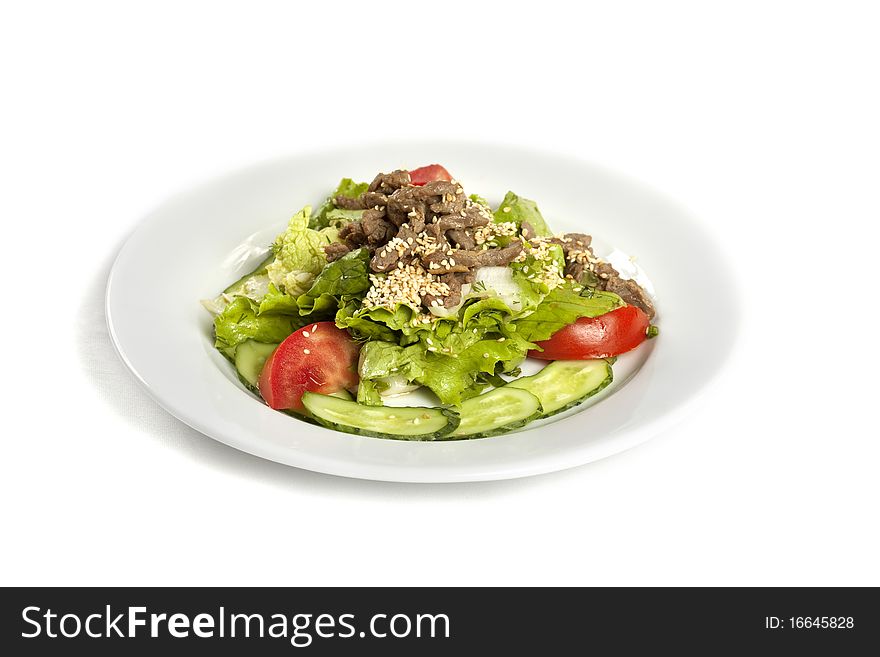 Sesame Beef  with Vegetables on a white ceramic plate