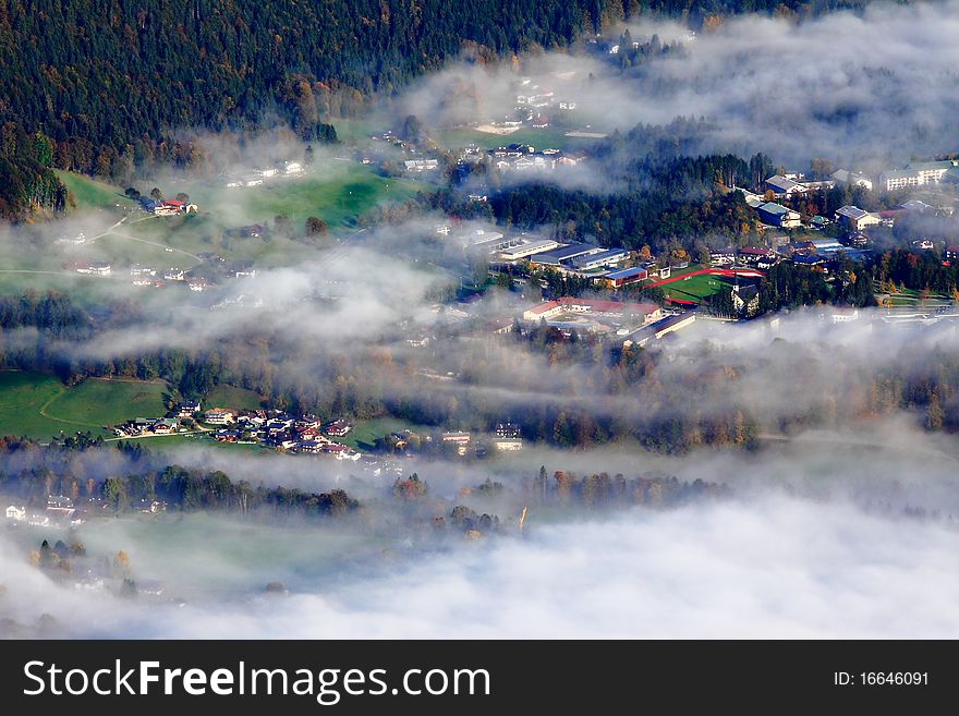 Village covered by fog in the morning, distant photograph from the mountain
