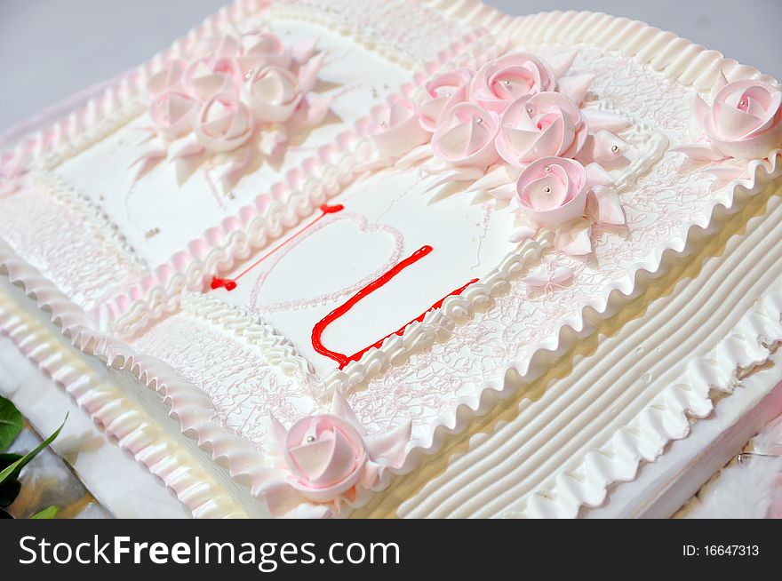 A pink wedding cake with book type