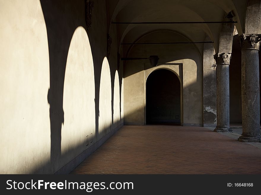 Arches in shadow in Milan