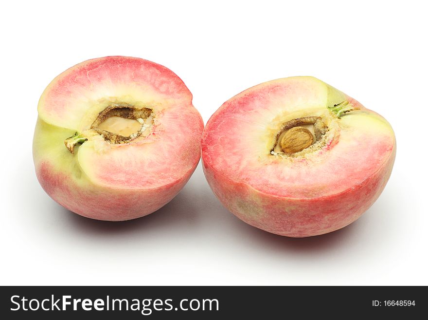 Cut peaches on white background