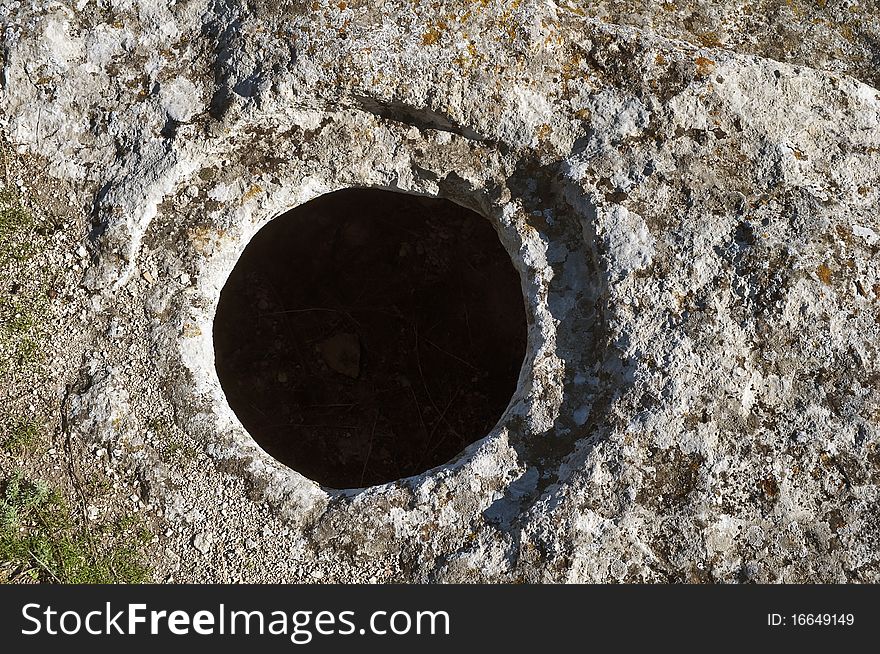 The hole in the rock. Medieval cave city Buckla in Crimea.