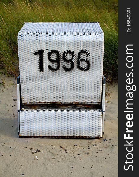 Hooded beach chair with number 1996 on german beach
