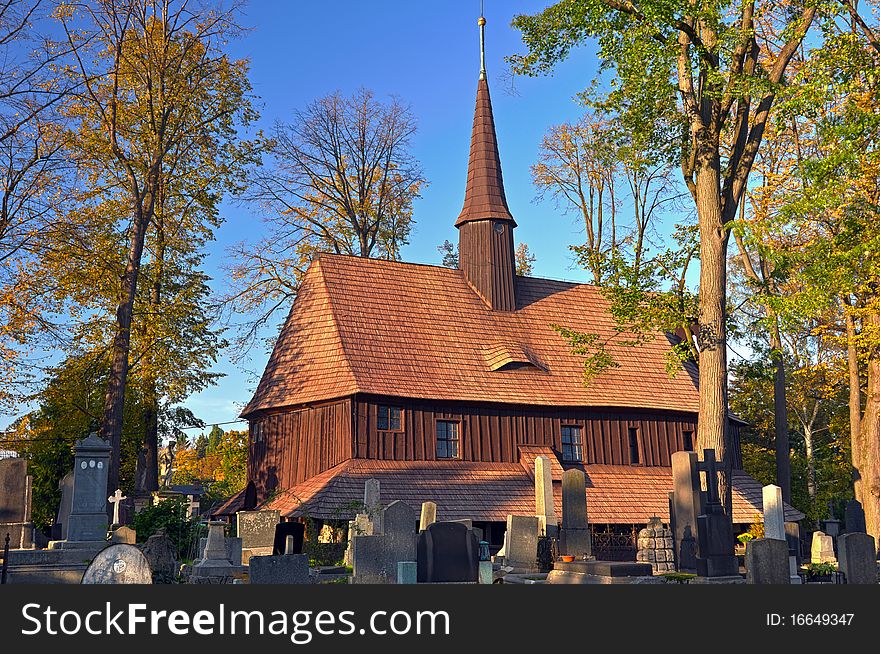 Old wooden church during the autumn time.