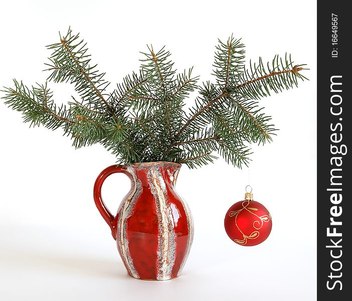 Christmas decoration in colored glass vase on white background