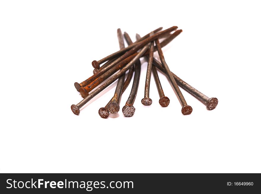 Photo of the rusty nails on white background