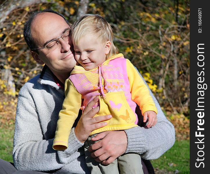 Loving father and daughter on natural background