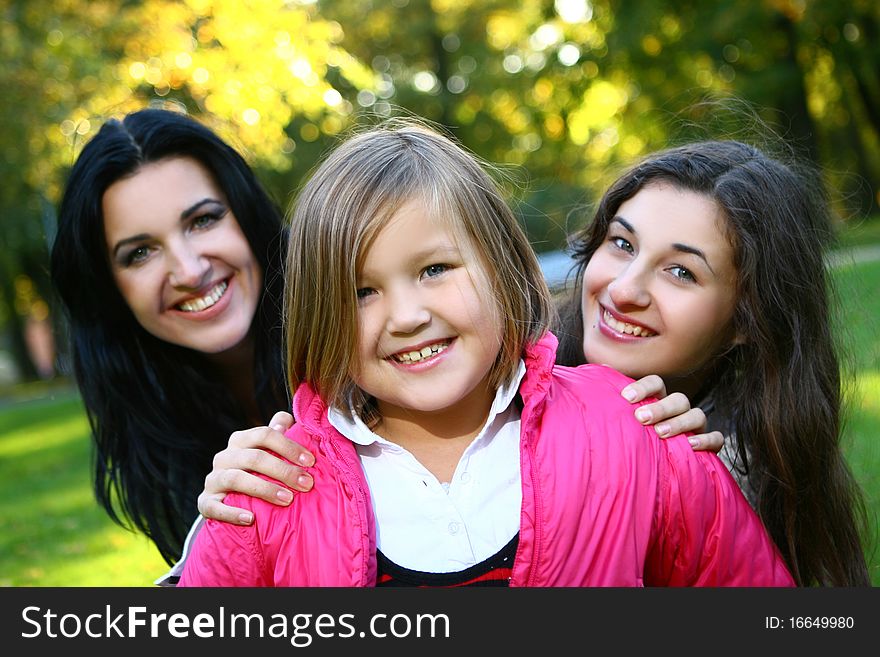 Family In Autumn Park